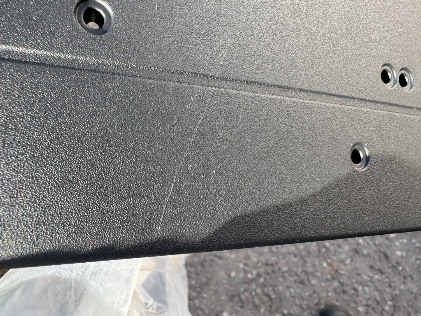 Licence plate holder Mercedes a2438855003 New but has a scratch