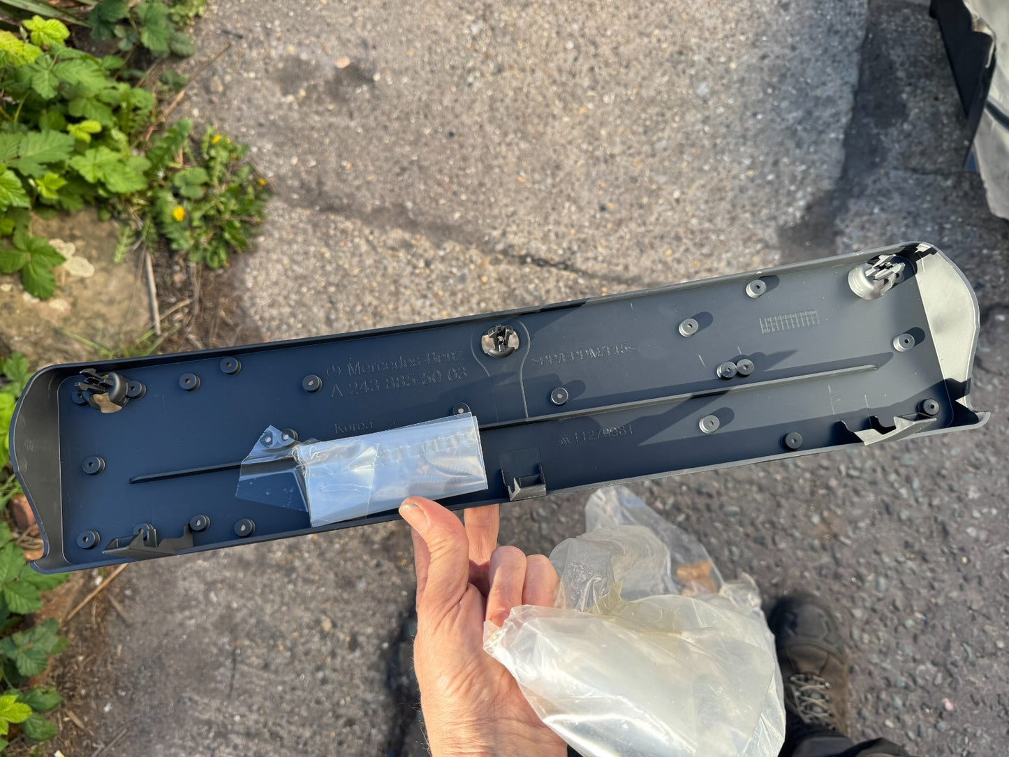Licence plate holder Mercedes a2438855003 New but has a scratch