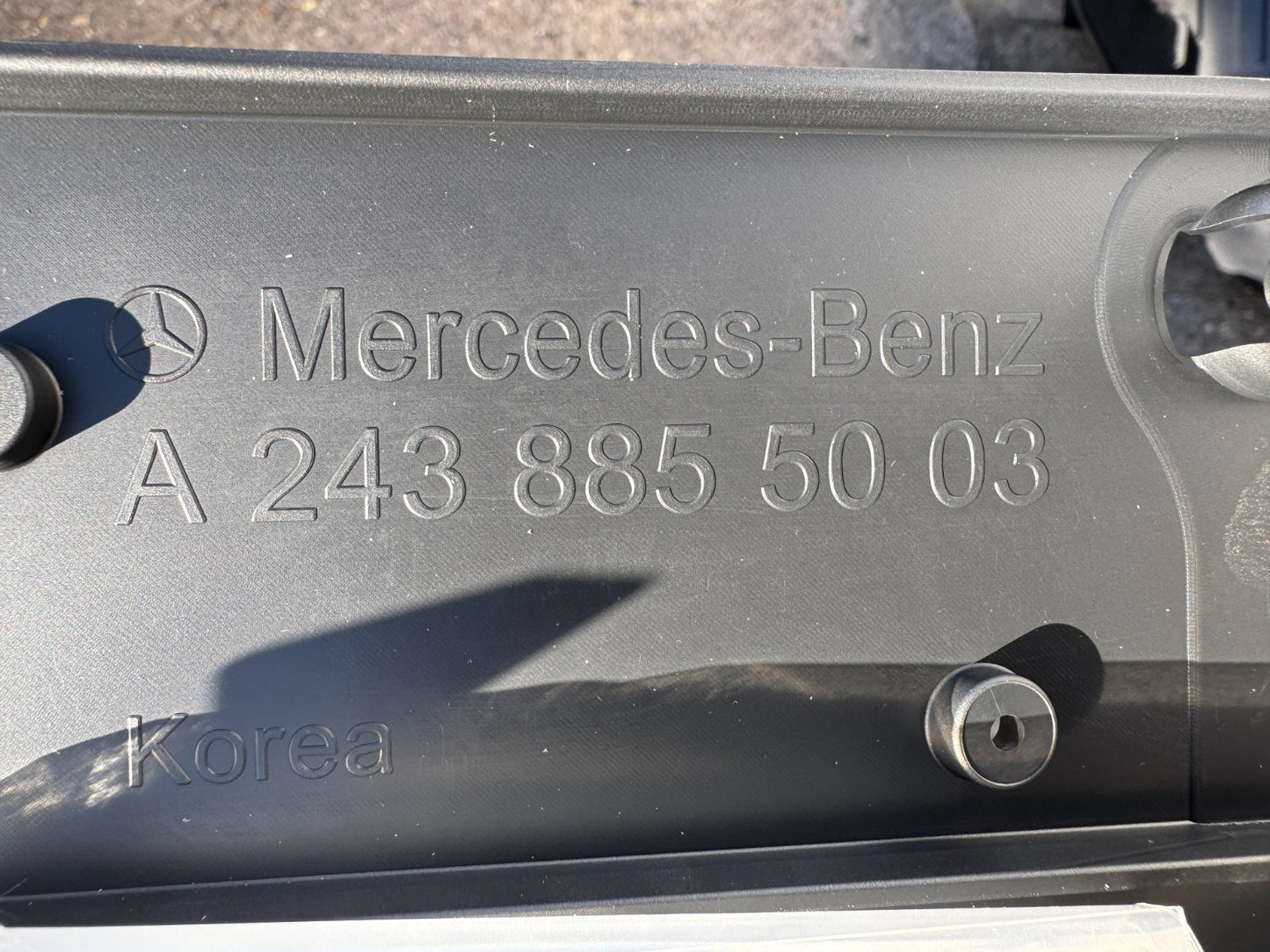 Licence plate holder Mercedes a2438855003 New but has a scratch