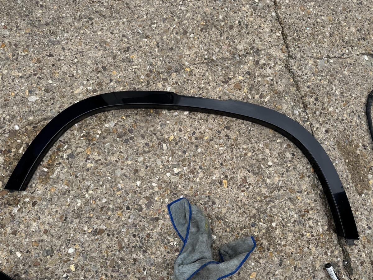 Defender L663 near Wheel Arch Trim, front left hand side L8B2-16A075-BX